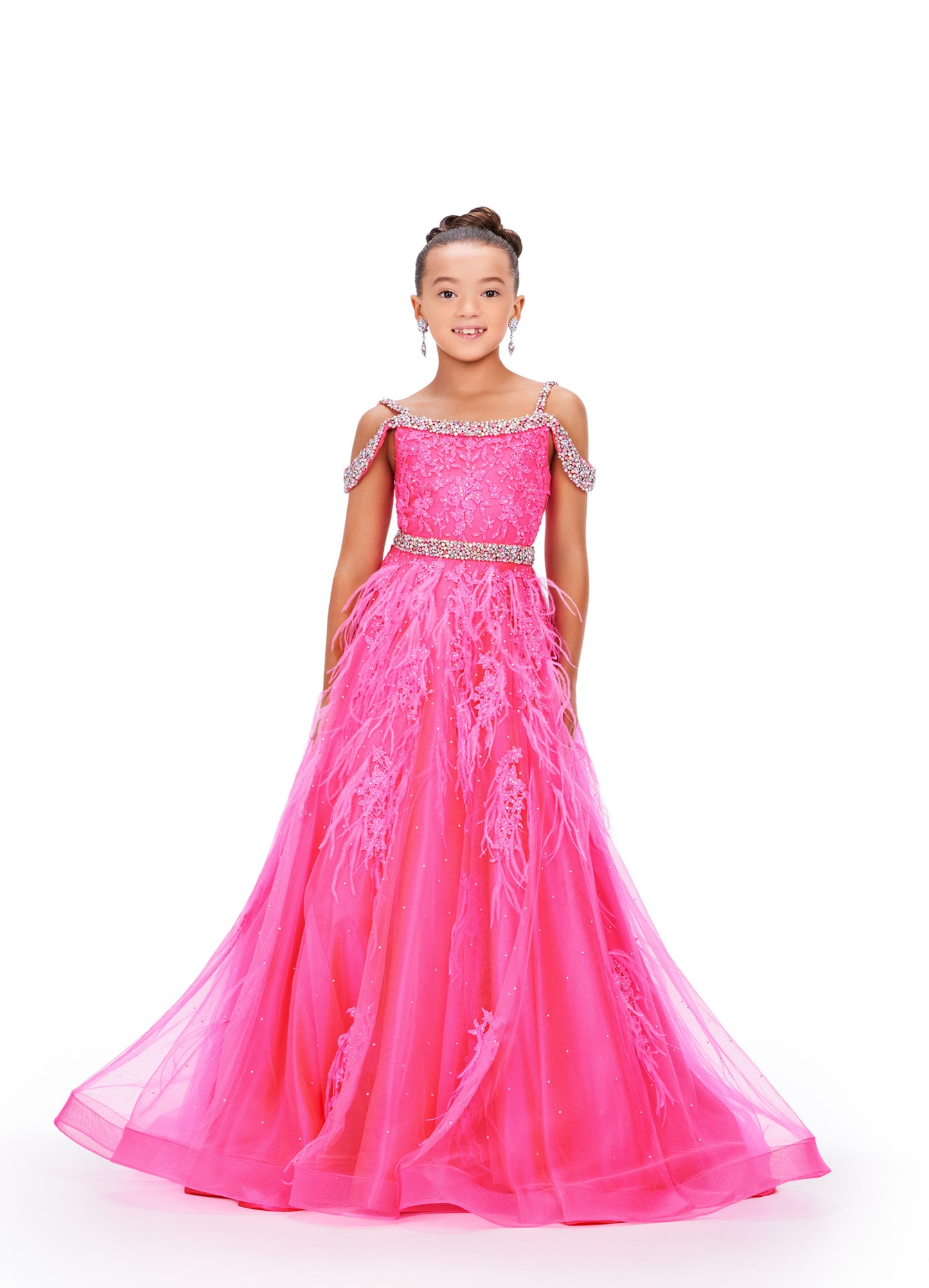 Experience the epitome of elegance and grace with the Ashley Lauren Kids 8242 Girls Lace Feather Pageant Dress. Featuring delicate lace and stunning feather accents, this off the shoulder ballgown is the perfect choice for any special occasion. Its impeccable design and craftsmanship will make your little girl feel like a true princess. This gorgeous kids gown is embellished with crystal beaded straps, neckline trim and belt. The dress is adorned with lace applique, press on stones and feather accents.