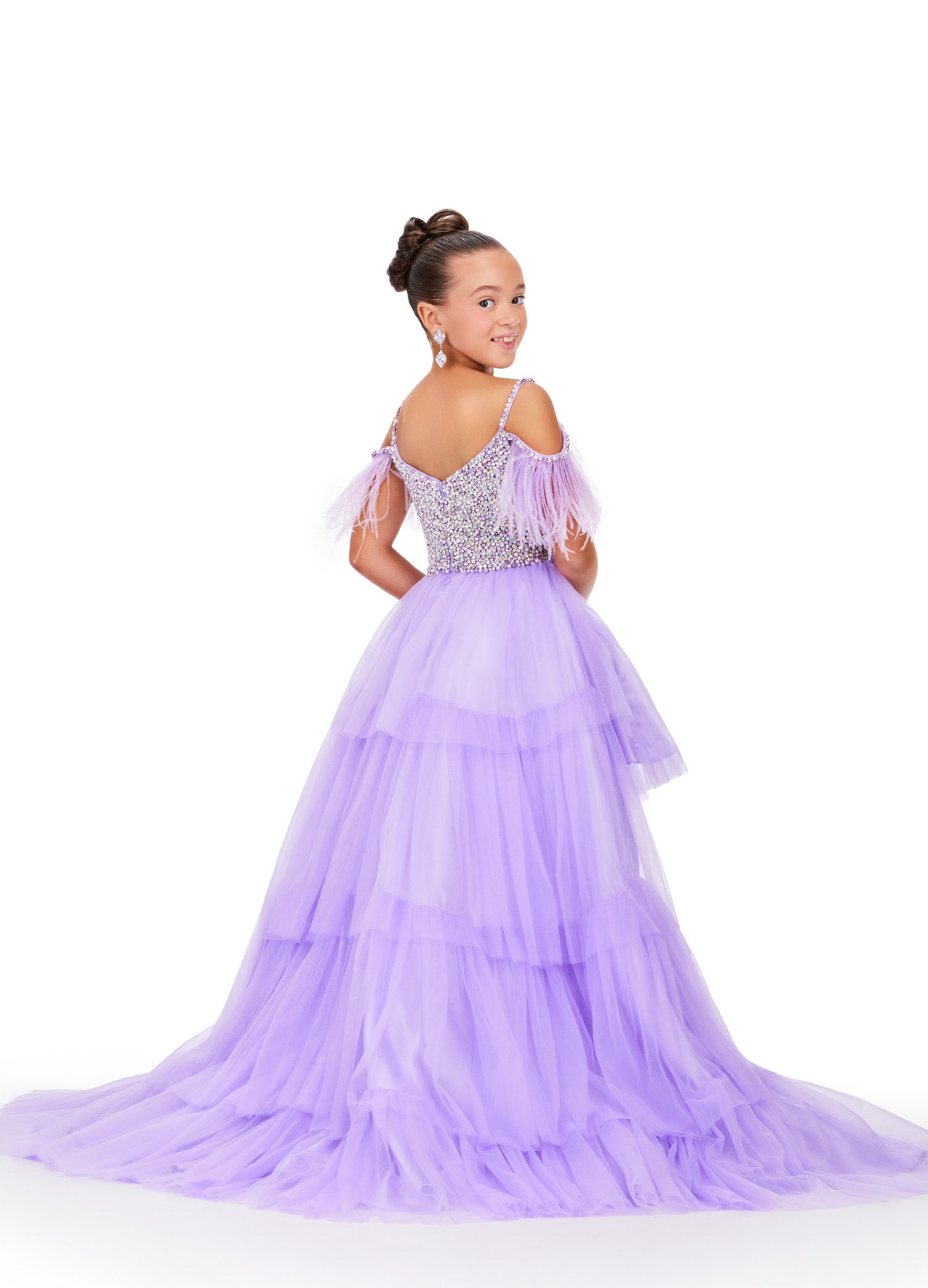 This Ashley Lauren Kids 8259 dress features layered tulle, a high low style, and an off the shoulder design with delicate feather accents. Perfect for pageants, your little girl will look stunning and feel confident in this unique and elegant dress. This fun & flirty kids tulle tiered high low features off the shoulder feather straps and a crystal encrusted bodice