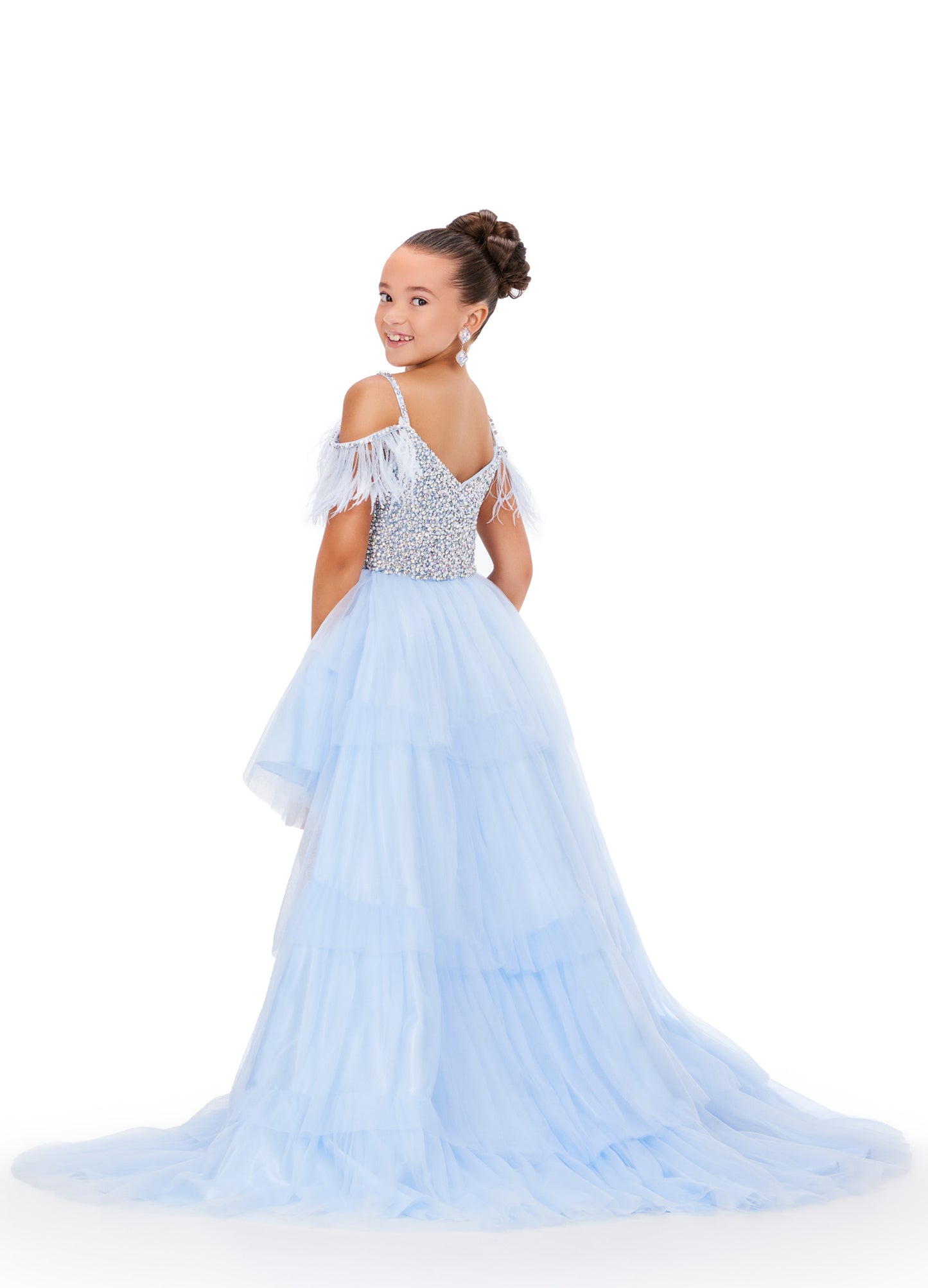 This Ashley Lauren Kids 8259 dress features layered tulle, a high low style, and an off the shoulder design with delicate feather accents. Perfect for pageants, your little girl will look stunning and feel confident in this unique and elegant dress. This fun & flirty kids tulle tiered high low features off the shoulder feather straps and a crystal encrusted bodice