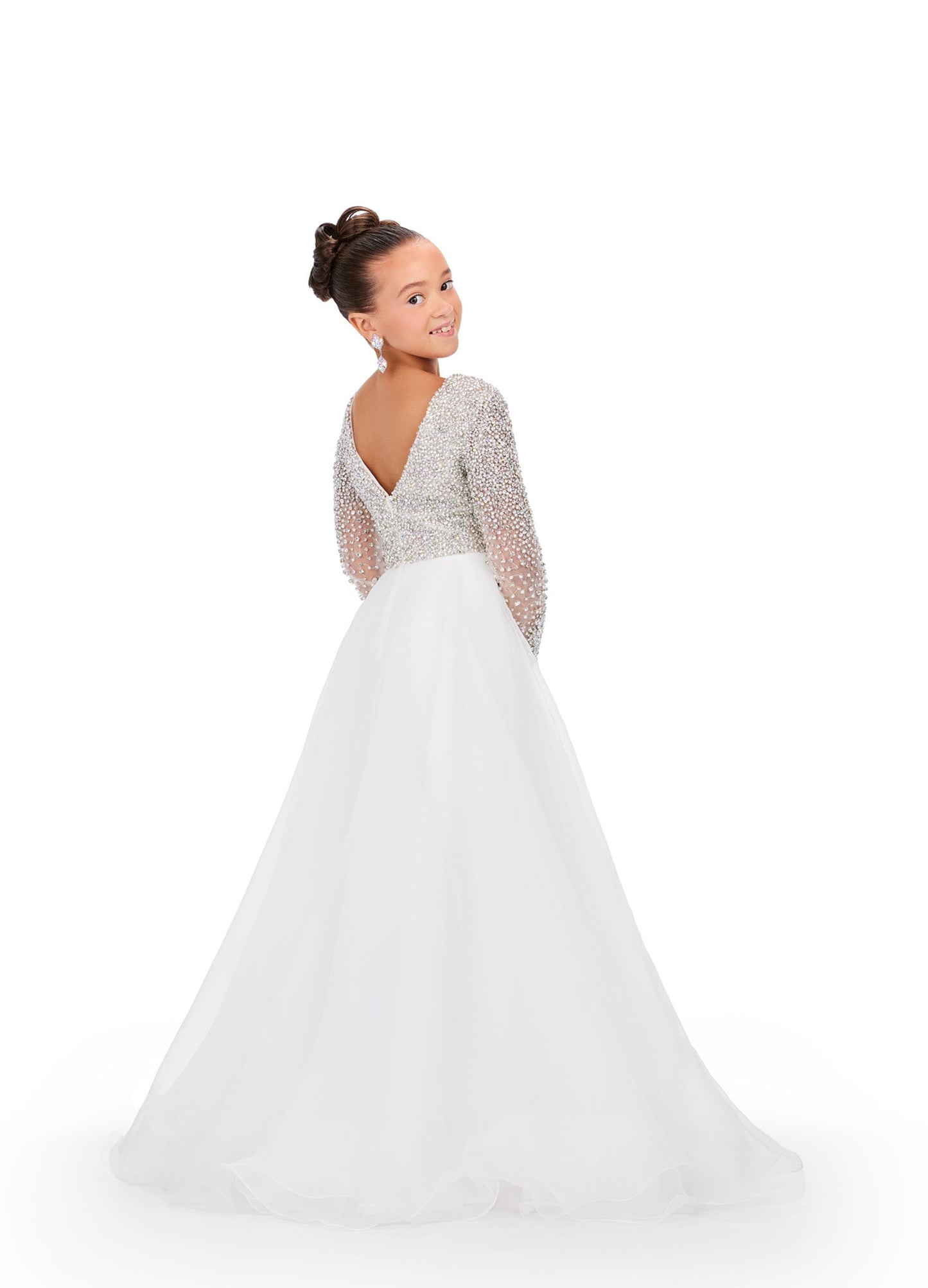 Elevate your little girl's style with this stunning Ashley Lauren Kids 8271 Pageant Dress. The intricate beaded details and long sleeve design add elegance and grace to the A-line silhouette, making her stand out on stage. Crafted with high-quality materials, this dress ensures unbeatable comfort and lasting wear. This elegant kids organza gown features a v-neckline with crystal and pearl details. The look is completed with long sleeves and an a-line skirt.