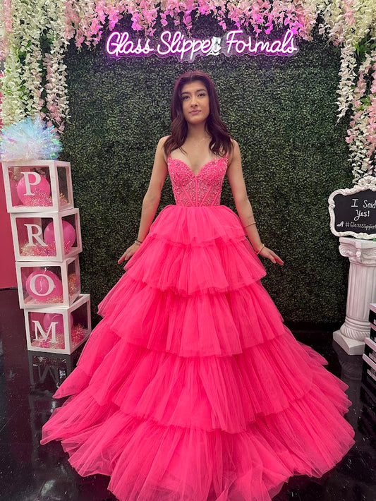 Experience luxury and elegance in the Amarra 88345 Ballgown. This stunning dress features sheer beaded corset detailing and layers of flowing fabric, creating a show-stopping look. Perfect for prom, pageants, or any formal event, this dress will make you feel like royalty.

Sizes: 000-16

Colors: Hot Pink,&nbsp;Ivory,&nbsp;Light Blue,&nbsp;Periwinkle,&nbsp;Red