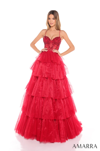 Experience luxury and elegance in the Amarra 88345 Ballgown. This stunning dress features sheer beaded corset detailing and layers of flowing fabric, creating a show-stopping look. Perfect for prom, pageants, or any formal event, this dress will make you feel like royalty.

Sizes: 000-16

Colors: Hot Pink,&nbsp;Ivory,&nbsp;Light Blue,&nbsp;Periwinkle,&nbsp;Red