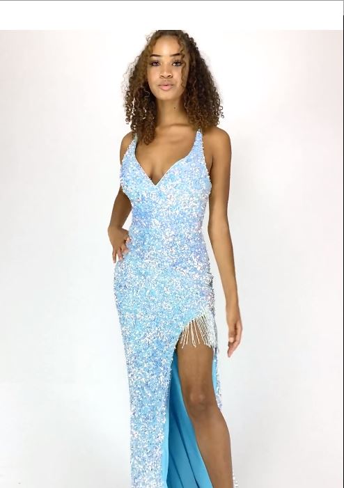 Make a statement at prom or pageants with the Vienna Prom 8846 dress. This elegant gown features a sequined velvet bodice, a V-neckline, and a high slit with fringe details. Look and feel confident in this formal dress that combines style and comfort.