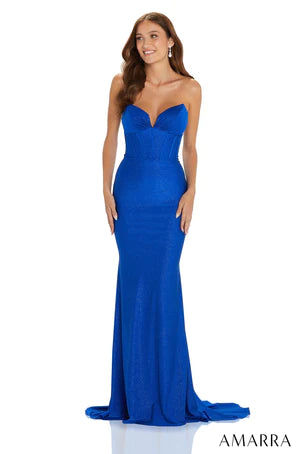Look and feel like a Hollywood star stepping onto the red carpet with AMARRA 88641. With a strapless fitted bodice and a ruched shimmer jersey skirt, this gown is sure to make you stand out from the crowd. With a zipper back, the gown provides support and stability, making it perfect for all-night dancing. With a beautiful shimmer finish, this dress will make you shine in the spotlight.