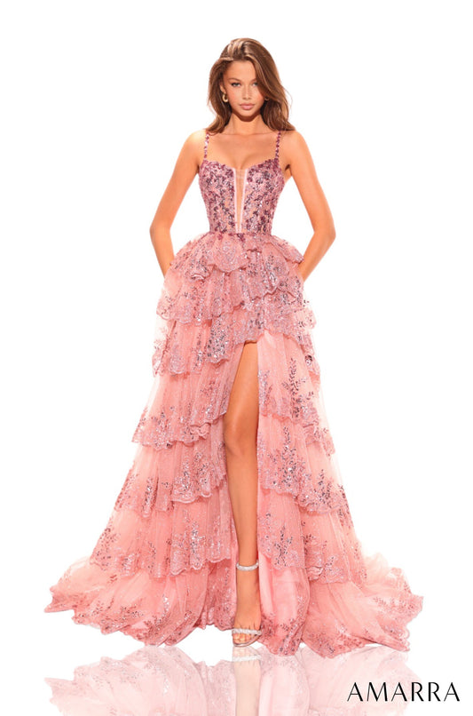 Elevate your glamour game with the Amarra 88745 Sequin Layer Maxi Slit Sheer Corset Prom Dress. The A-line silhouette and corset-style bodice flatter your figure, while the sequin layer adds a touch of sparkle. With a daring slit and sheer detailing, this dress is perfect for formal events or pageants. 
