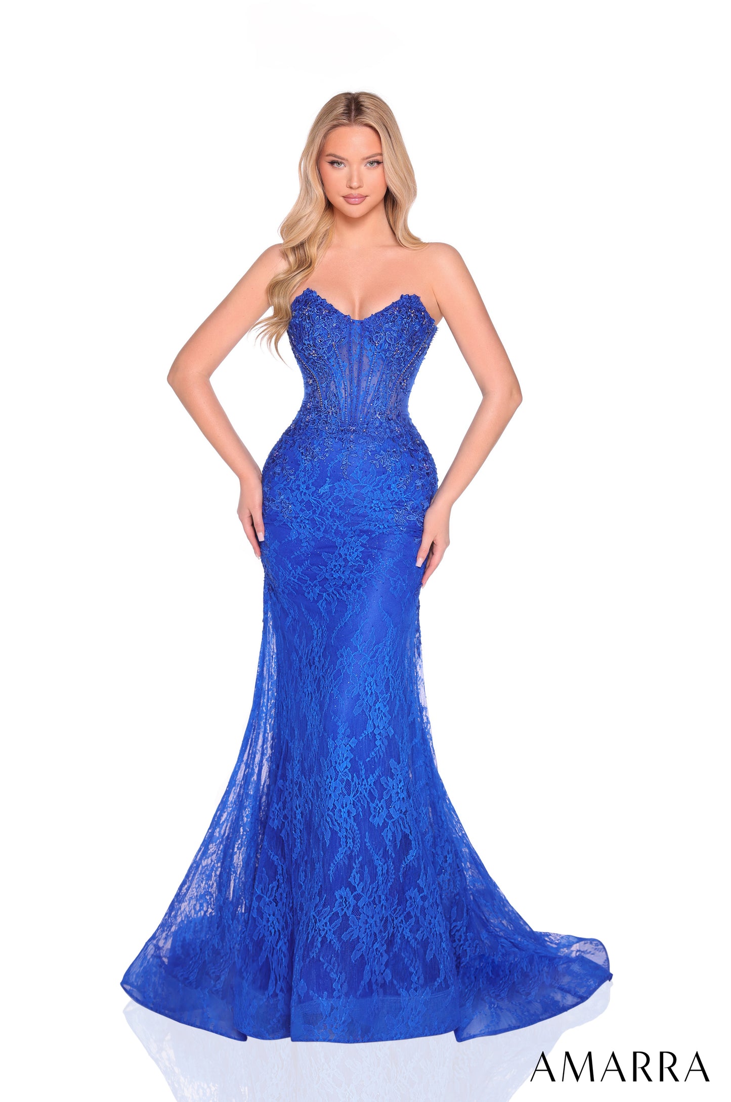 The Amarra 88923 gown combines timeless elegance with modern design. Featuring intricate sequin lace, this long mermaid-style dress contours the body for a flattering silhouette. The sheer corset bodice offers refined support and adds a sophisticated, alluring touch. Perfectly suited for formal evenings and prom, it delivers both luxury and comfort, ensuring a memorable and confident appearance. Regal and refined, AMARRA 88923 is a lace mermaid gown with a structured corset bodice, intricate beading, and a 