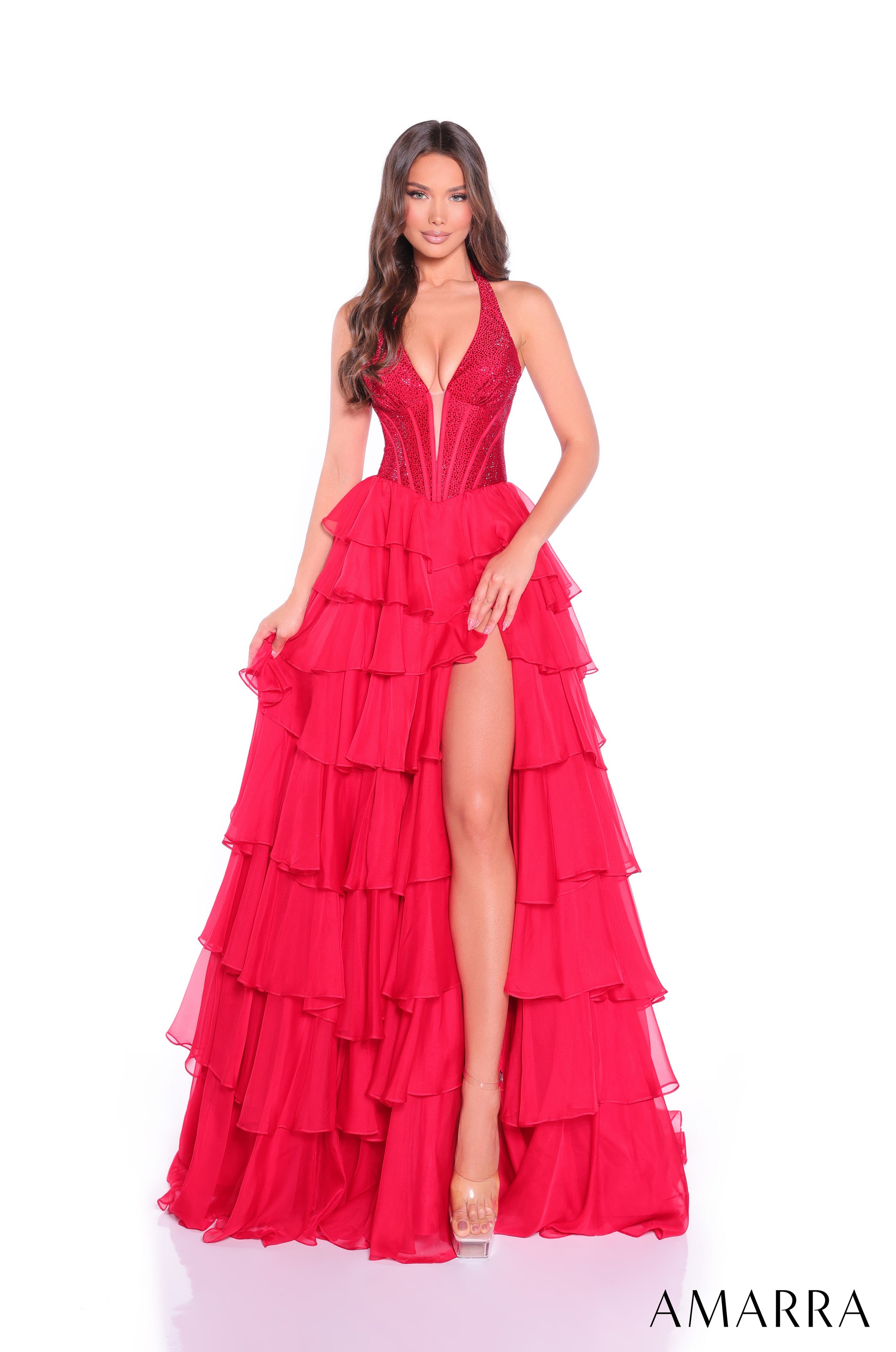 Elevate your prom night with the Amarra 89287, a stunning crystal-embellished halter corset gown designed to captivate. This sophisticated A-line silhouette features a structured corset bodice adorned with intricate crystal detailing that catches light beautifully. The dramatic layered ruffle skirt with a daring slit creates movement and elegance with every step. Perfect for those seeking a show-stopping formal look that balances glamour with refined style.

Sizes: 000-20

Colors: Bright Pink,&nbsp;Light Ye