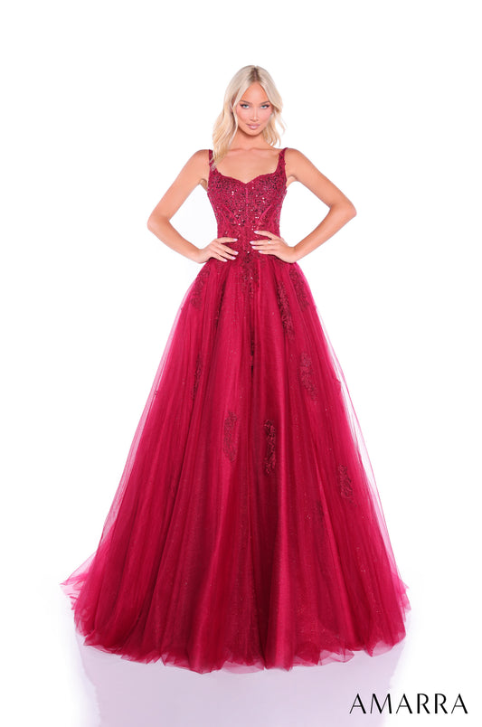 Elevate your formal event presence with the Amarra 89429, a stunning ballgown that seamlessly blends sophistication with dramatic elegance. This A-line silhouette features an intricately embellished sheer lace corset bodice that creates a refined, structured look while the voluminous tulle skirt provides the timeless grandeur expected of a show-stopping prom dress. The delicate lace detailing catches light beautifully, ensuring you command attention throughout the evening. Perfect for prom, pageants, or any