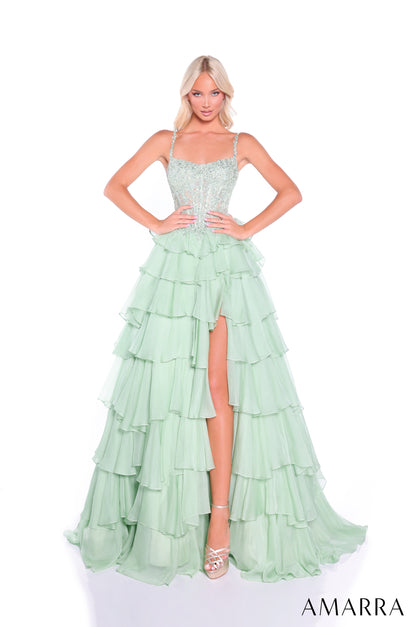 Make a stunning entrance in this Amarra 89507 prom dress, featuring an elegant sheer lace scoop neckline and structured basque waist corset that flatters your silhouette. The dramatic ruffle layered skirt adds movement and dimension, while the front slit provides both sophistication and ease of movement. Crafted with intricate lace detailing throughout, this dress combines timeless elegance with contemporary design—perfect for prom, formal events, or special occasions where you want to command attention.

S