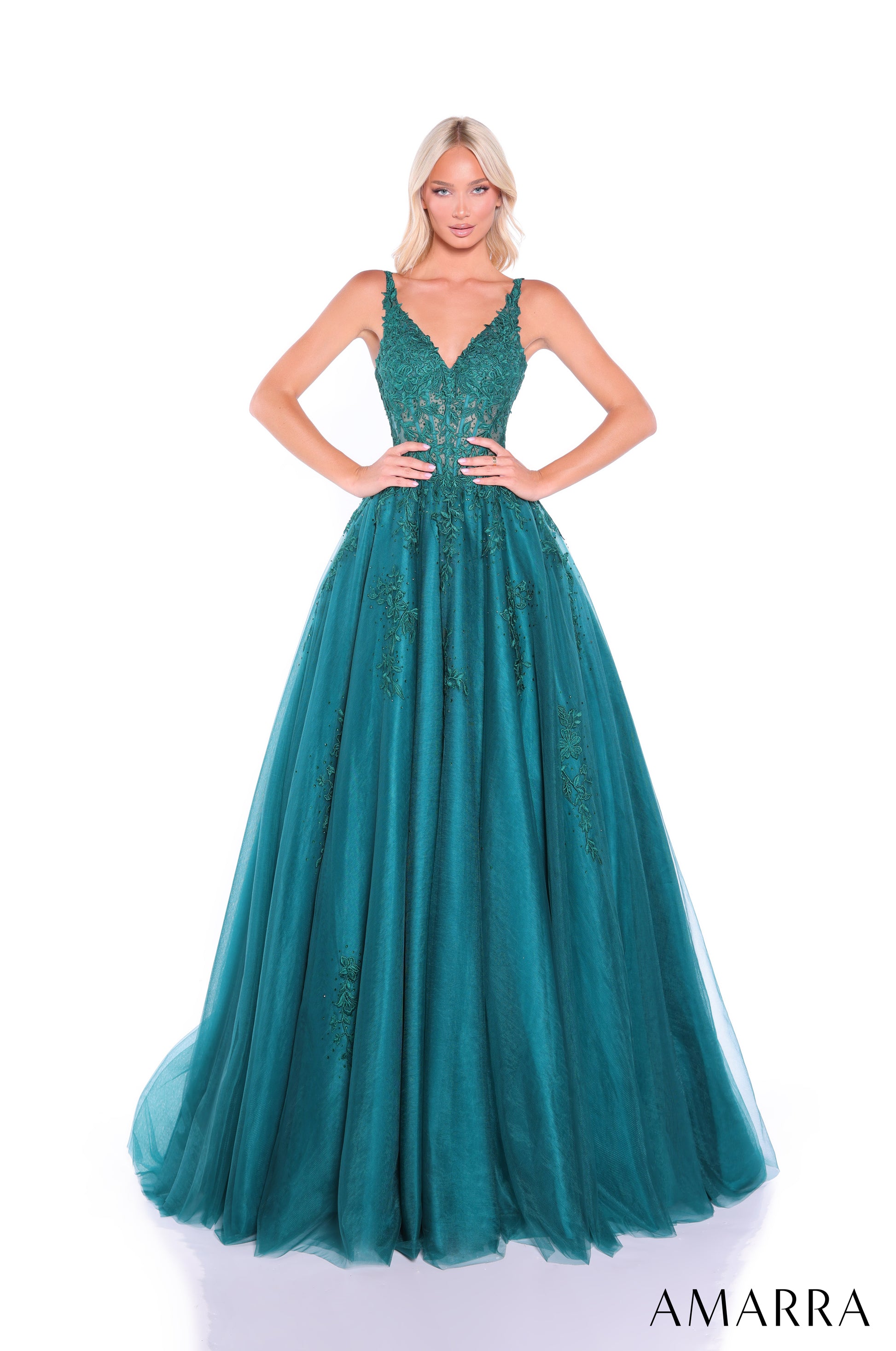 Amarra's 89523 presents an elegant ballgown silhouette designed for the discerning prom attendee. The sheer lace corset bodice creates a sophisticated foundation, while the voluminous A-line tulle skirt delivers the dramatic presence expected of formal wear. The V-neckline offers a flattering frame that balances the gown's generous volume. This dress combines structured bodice support with flowing skirt movement, making it suitable for extended wear throughout the evening. The intricate lace detailing adds 