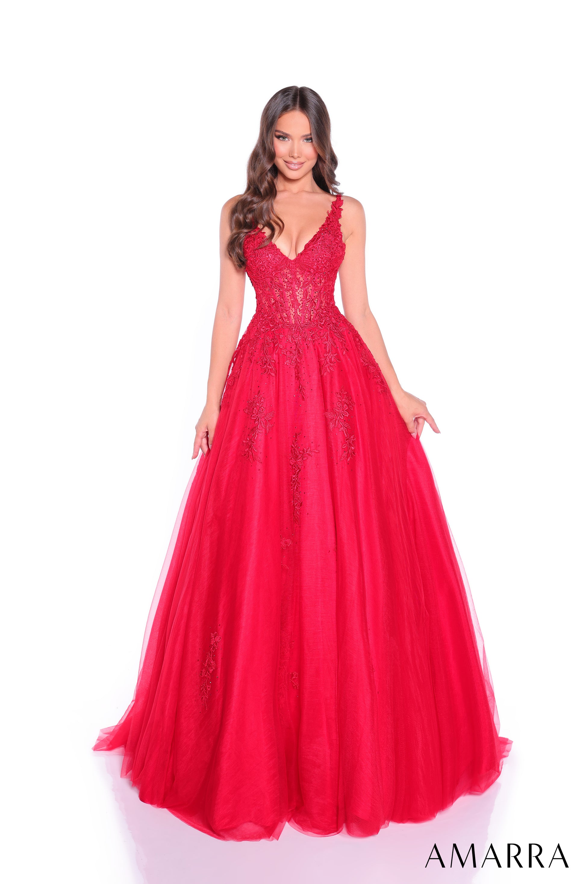 Amarra's 89523 presents an elegant ballgown silhouette designed for the discerning prom attendee. The sheer lace corset bodice creates a sophisticated foundation, while the voluminous A-line tulle skirt delivers the dramatic presence expected of formal wear. The V-neckline offers a flattering frame that balances the gown's generous volume. This dress combines structured bodice support with flowing skirt movement, making it suitable for extended wear throughout the evening. The intricate lace detailing adds 