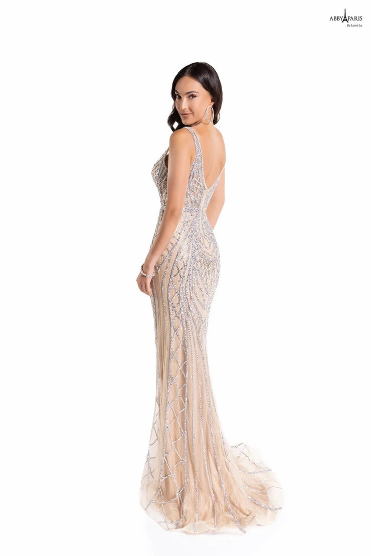 The Abby Paris 90156 prom dress is a standout piece for any special event. This fit and flare silhouette showcases a plunging neckline and beautiful embroidery with an elegant tulle overlay. Show up in style at your next event with this stunning long dress.