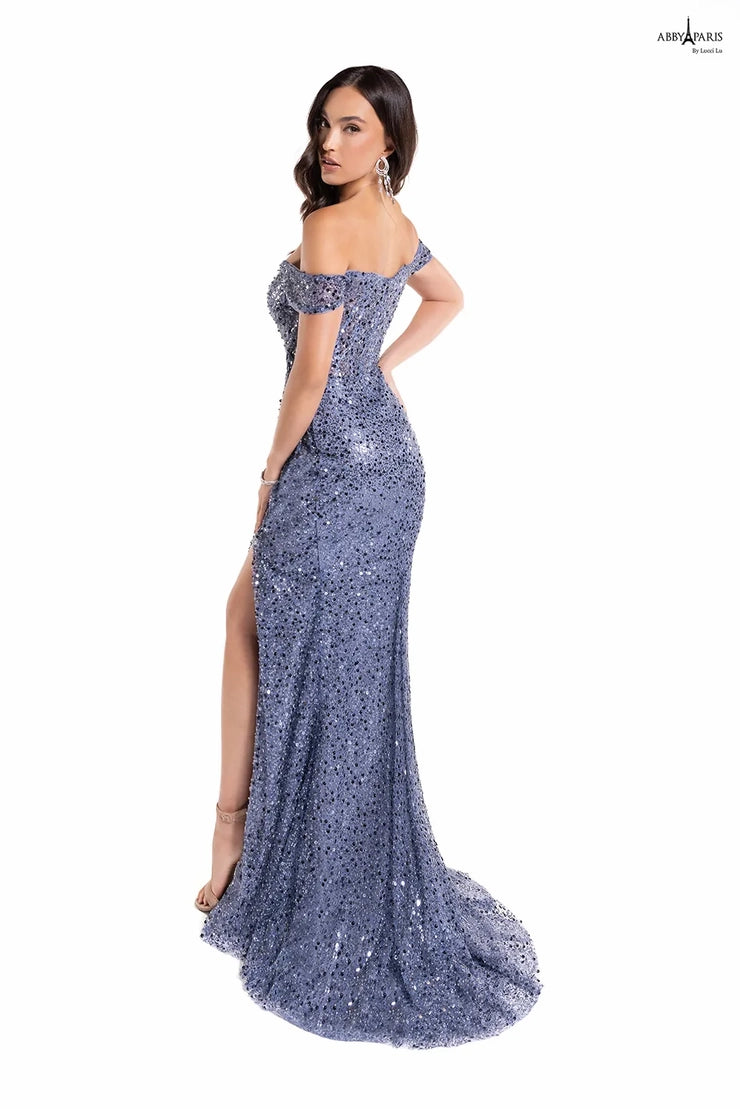 The Abby Paris 90177 Long Prom Dress is perfect for any special event. Crafted from sheer tulle and embroidered detailing, this dress features an off-the-shoulder neckline, a stylish corset bodice, and a beautiful slit back. An elegant and sophisticated must-have.