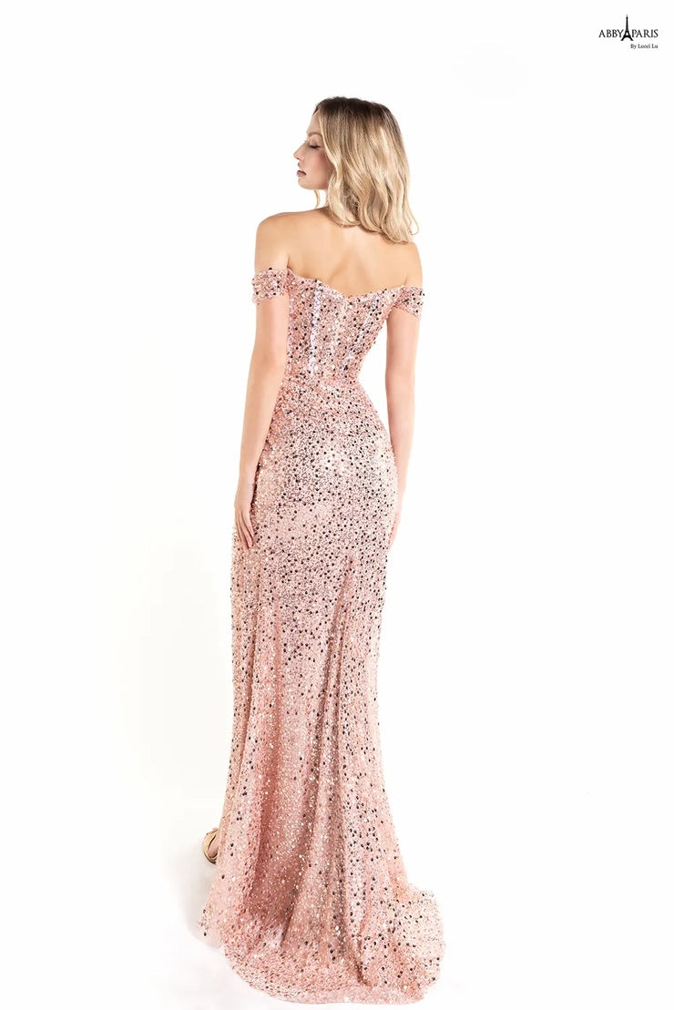 The Abby Paris 90177 Long Prom Dress is perfect for any special event. Crafted from sheer tulle and embroidered detailing, this dress features an off-the-shoulder neckline, a stylish corset bodice, and a beautiful slit back. An elegant and sophisticated must-have.