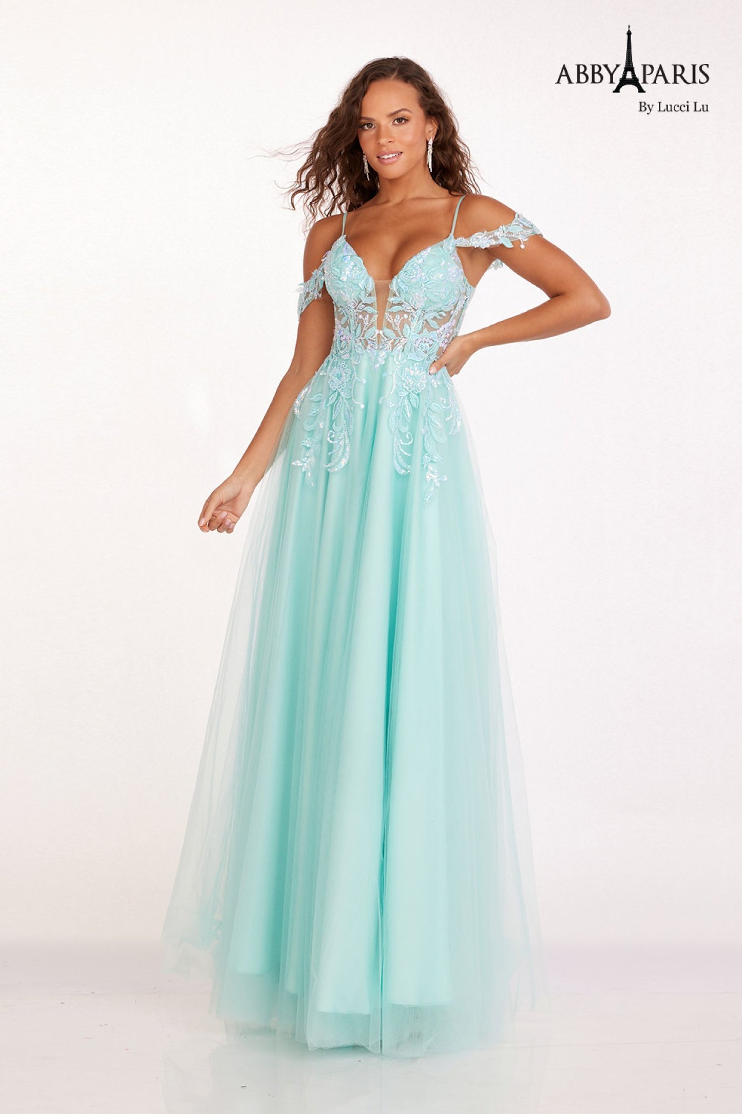 The Abby Paris 90242 Sheer Sequin Corset offers a stunning off-the-shoulder A-line silhouette, perfect for any formal event. The sheer sequin design adds a touch of glamour, while the corset structure provides a flattering fit. Make a statement and turn heads with this elegant and sophisticated prom dress.  Sizes: 0-14  Colors: Aqua