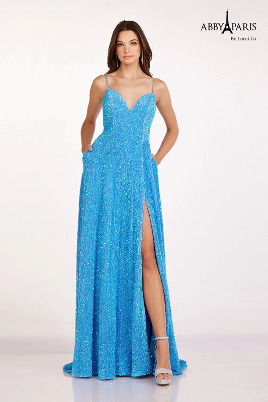 Be the center of attention in the Abby Paris 90247 A Line Velvet Sequin Ballgown. This stunning dress features a V-neckline and A-line silhouette that flatters any figure. The velvet fabric and sequin embellishments add a touch of luxury, while the maxi slit and pockets provide practicality. Perfect for prom or any formal event.  Sizes: 0-20  Colors: Dolphin Blue, Magenta