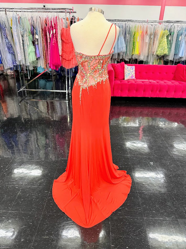 Jovani 91220 Long asymmetrical fitted formal prom &amp; Pageant dress. Fully embellished bodice with a one shoulder neckline. embellishments cascading down to the slit in skirt and a sweeping train.&nbsp;

Available Color: Coral (Bright)

Available Size: 10