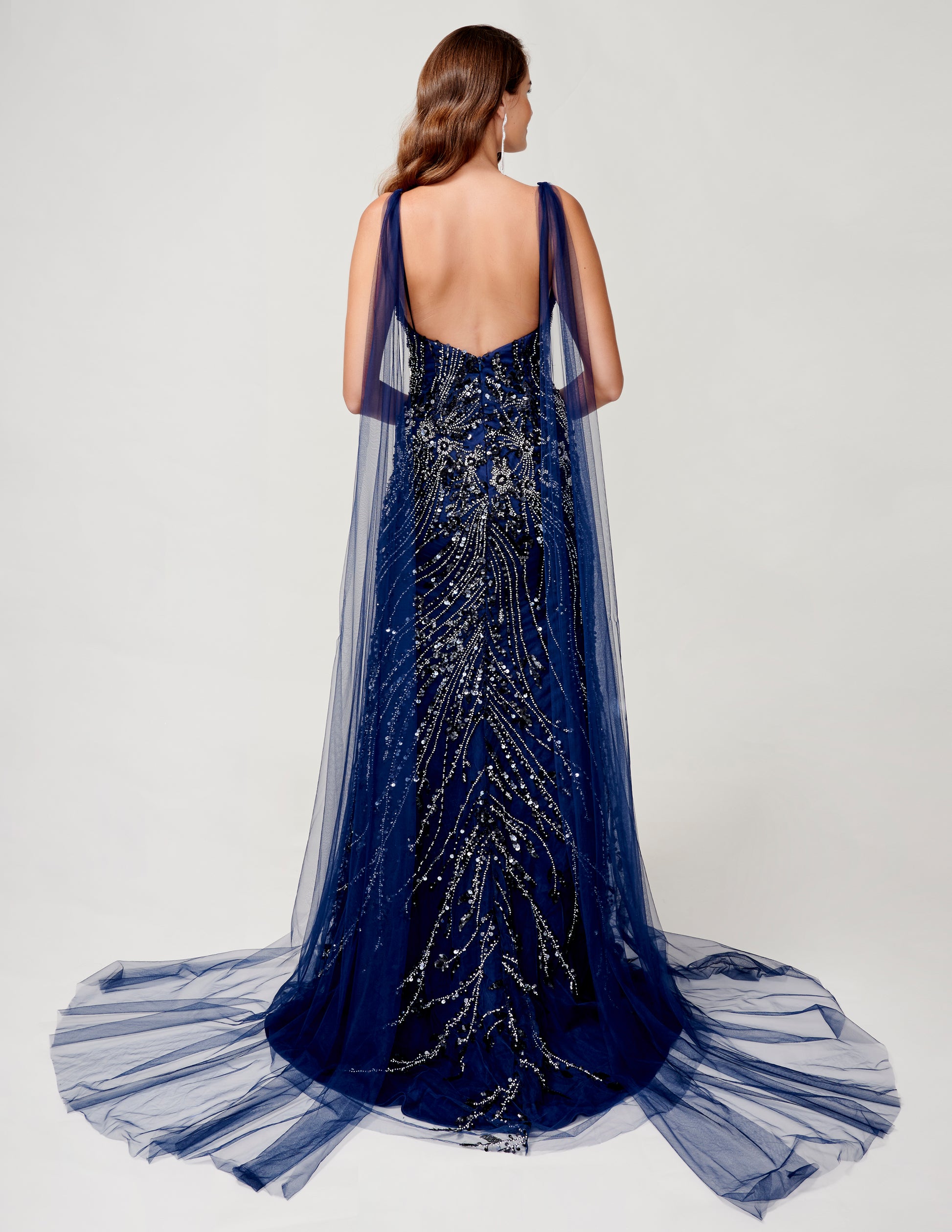 <p data-mce-fragment="1">Slip into elegance with the Nina Canacci 9153 Size 6 Navy Beaded Cape Dress. Featuring a fitted silhouette and a stunning beaded cape, this formal gown will make you stand out at any pageant or evening event. The slit adds a touch of sophistication while the capes bring a unique and stylish element to this navy dress.</p> <p data-mce-fragment="1">Size: 6</p> <p data-mce-fragment="1">Colors: Navy</p>