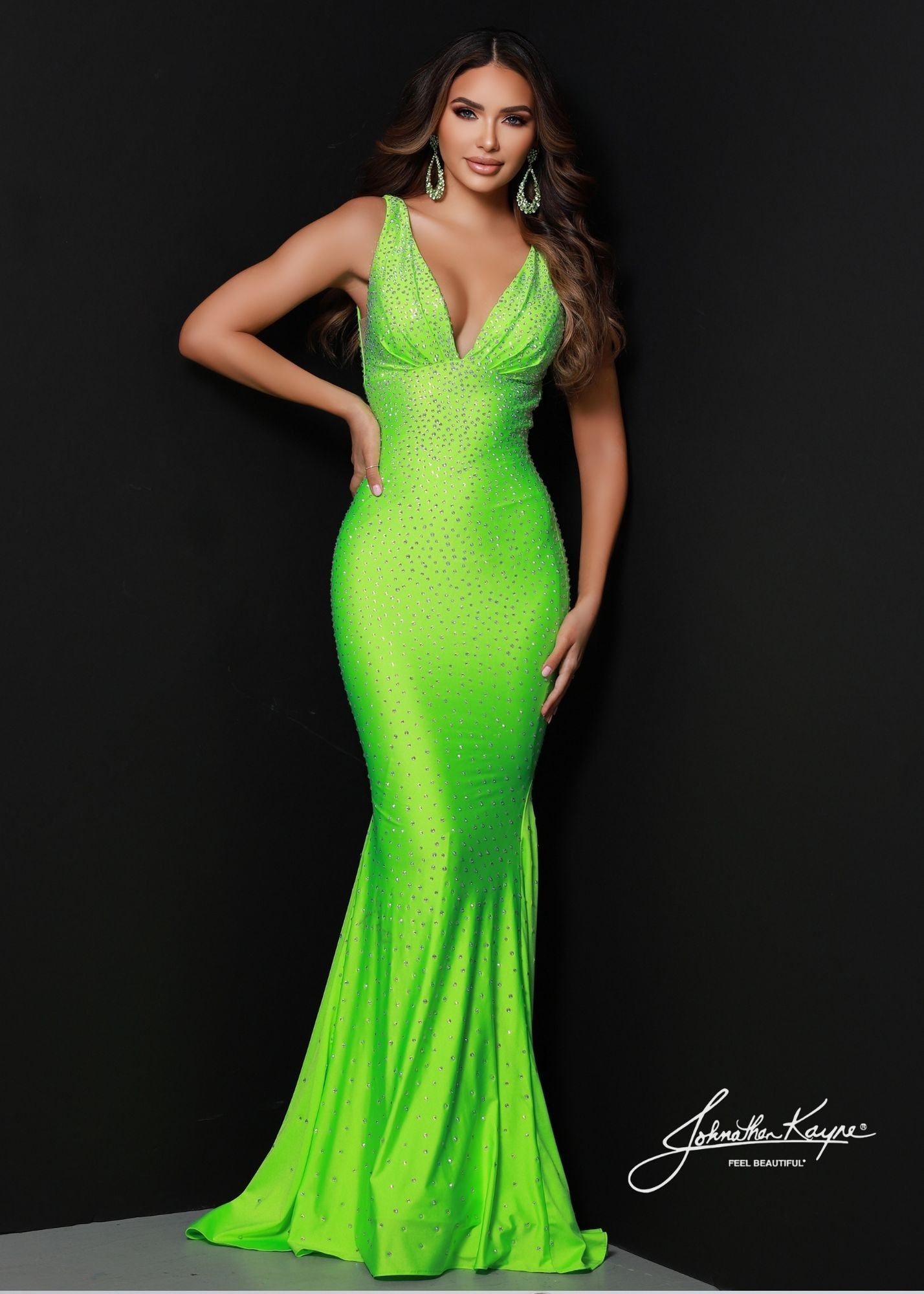 Johnathan Kayne 9213 is an embellished stretch Prom Dress, Pageant Gown & Formal Evening Wear. One of Johnathan Kayne's favorite styles for the Fall season, this elegant 4 way stretch lycra gown has a modern empire bodice and hugs the body all the way to the dramatic train. Adorn in shimmering crystals, this gem of a gown will turn heads.