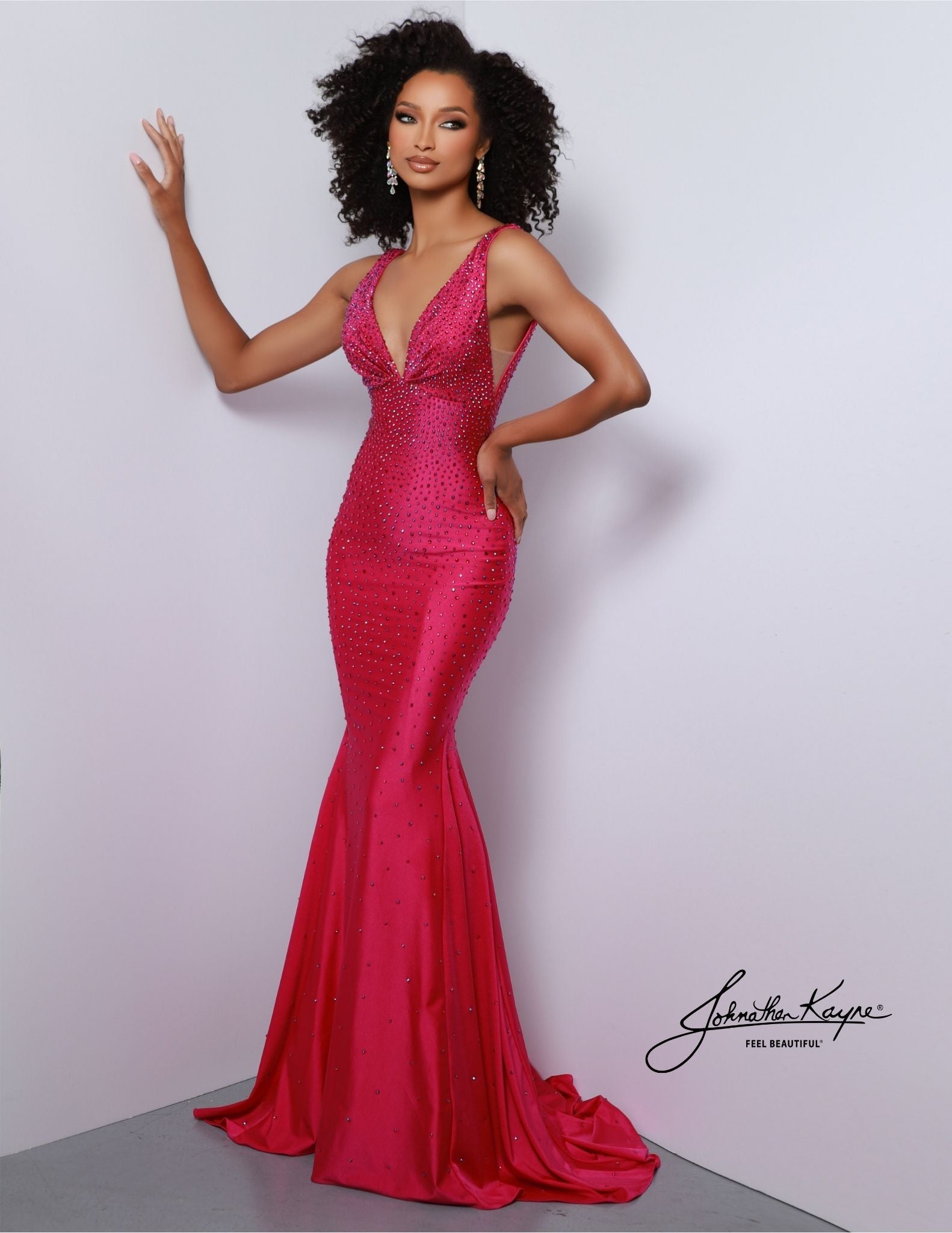 Johnathan Kayne 9213 is an embellished stretch Prom Dress, Pageant Gown & Formal Evening Wear. One of Johnathan Kayne's favorite styles for the Fall season, this elegant 4 way stretch lycra gown has a modern empire bodice and hugs the body all the way to the dramatic train. Adorn in shimmering crystals, this gem of a gown will turn heads.