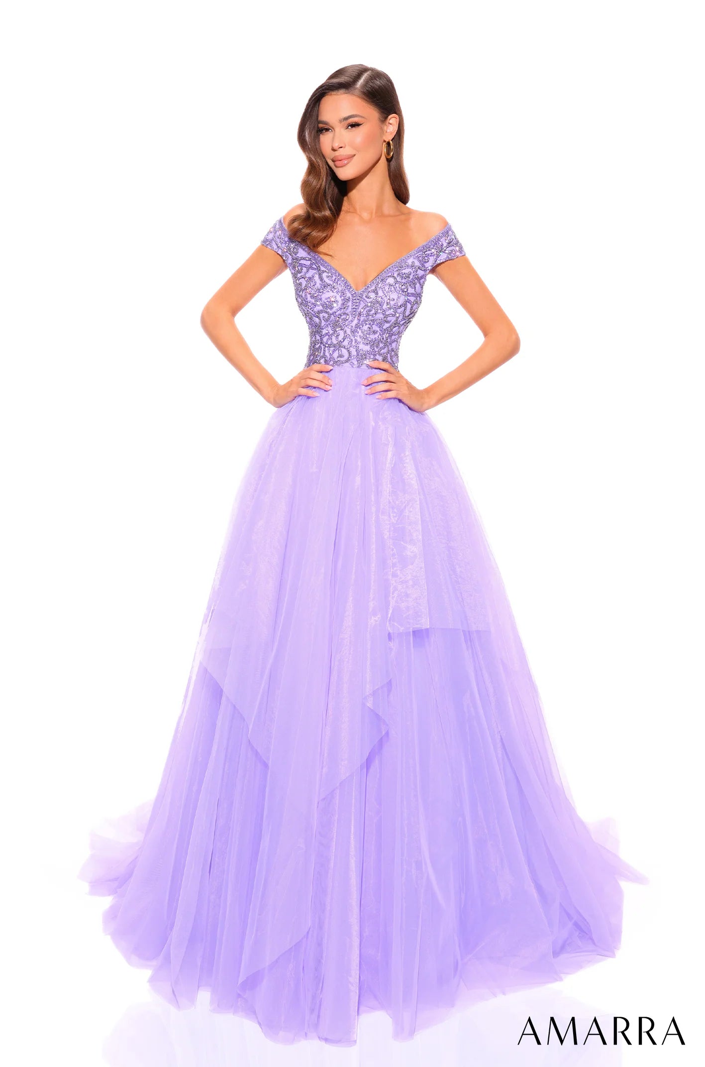This dazzling prom dress radiates charm, romance and magic - all ingredients for a perfect prom night. The bodice is magnificently designed with labyrinthine rhinestone detail, highlighted by the off-the-shoulder sleeve and flirtatious sweetheart neckline that will capture the attention of anyone that beholds you. However, that is not the main piece of this gorgeous attire. 