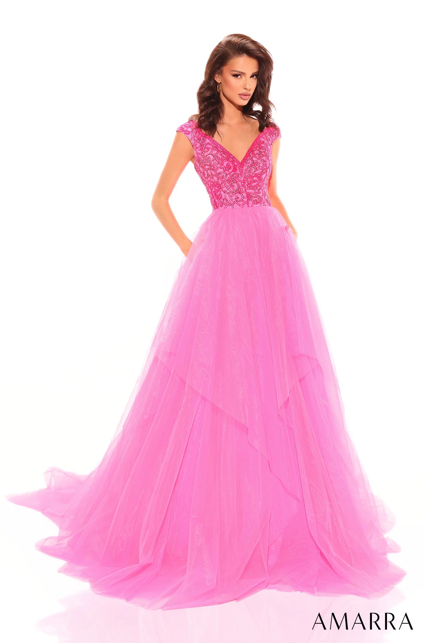 This dazzling prom dress radiates charm, romance and magic - all ingredients for a perfect prom night. The bodice is magnificently designed with labyrinthine rhinestone detail, highlighted by the off-the-shoulder sleeve and flirtatious sweetheart neckline that will capture the attention of anyone that beholds you. However, that is not the main piece of this gorgeous attire. 