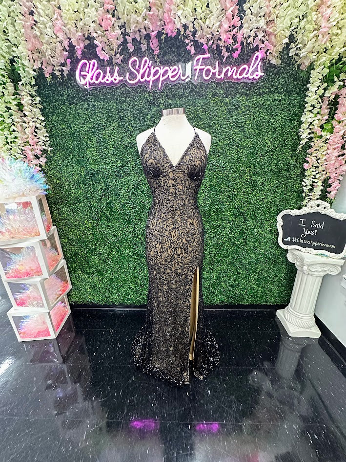 Introducing the stunning Amarra 94144 prom dress!&nbsp; this backless gown features beautiful beaded sequins that will make you shine on your special night. With its form-fitting design and intricate detailing, this dress is perfect for any formal occasion.

Size: 14

Colors: Black/Nude&nbsp;