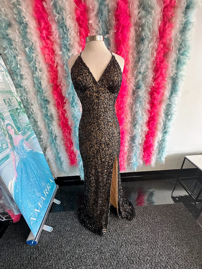 Introducing the stunning Amarra 94144 prom dress!&nbsp; this backless gown features beautiful beaded sequins that will make you shine on your special night. With its form-fitting design and intricate detailing, this dress is perfect for any formal occasion.

Size: 14

Colors: Black/Nude&nbsp;