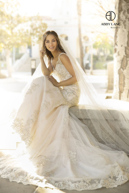 This Abby Lane wedding dress in sizes 4 and 12 features an elegant ivory champagne lace design that beautifully contours the body with a mermaid fit and flare silhouette. Delicate buttons add a refined touch to this sophisticated bridal gown, perfect for a timeless and graceful wedding day look.

Size: 4, 12

Color: Ivory/Champagne