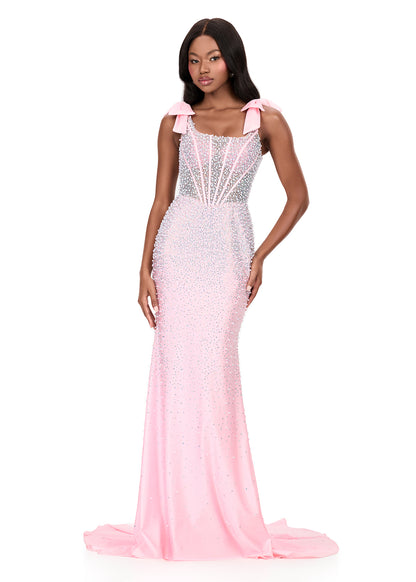 Make them stop and stare in this stunning ASHLEYlauren Style 12179 pearl jersey gown. This fitted dress features elegant bow shoulder straps, a flattering square neckline, and a v-back for a touch of sophistication. The intricate beadwork cascades beautifully down the gown, highlighting your figure and finishing with a dramatic sweep train—perfect for prom, pageant, or evening events.

Available in Red, Sky, White, Ice Pink, and Black
Perfect for Galas, Black Tie Formals, Prom, and Special Occasions
Fitted 