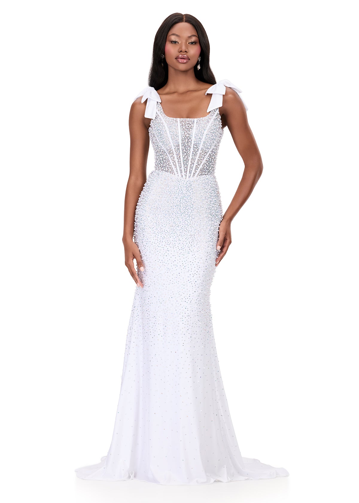 Make them stop and stare in this stunning ASHLEYlauren Style 12179 pearl jersey gown. This fitted dress features elegant bow shoulder straps, a flattering square neckline, and a v-back for a touch of sophistication. The intricate beadwork cascades beautifully down the gown, highlighting your figure and finishing with a dramatic sweep train—perfect for prom, pageant, or evening events.

Available in Red, Sky, White, Ice Pink, and Black
Perfect for Galas, Black Tie Formals, Prom, and Special Occasions
Fitted 