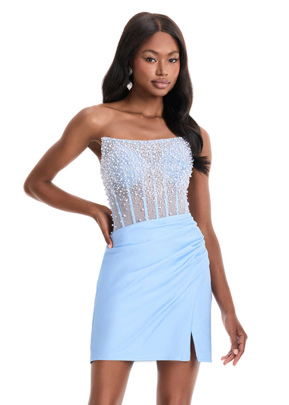 Elevate your evening with the ASHLEYlauren 4923 Sheer Crystal Corset Homecoming Dress. Featuring a delicate scoop neckline and a daring slit, this cocktail gown combines elegance with a modern edge. The sheer crystal corset detail adds a touch of sparkle, perfectly accentuating your silhouette for a refined and captivating look. Ideal for homecoming or any special occasion where sophistication is key. Turn heads in the ASHLEYlauren Style 4923 mini dress featuring a beautifully beaded mesh bodice paired wit