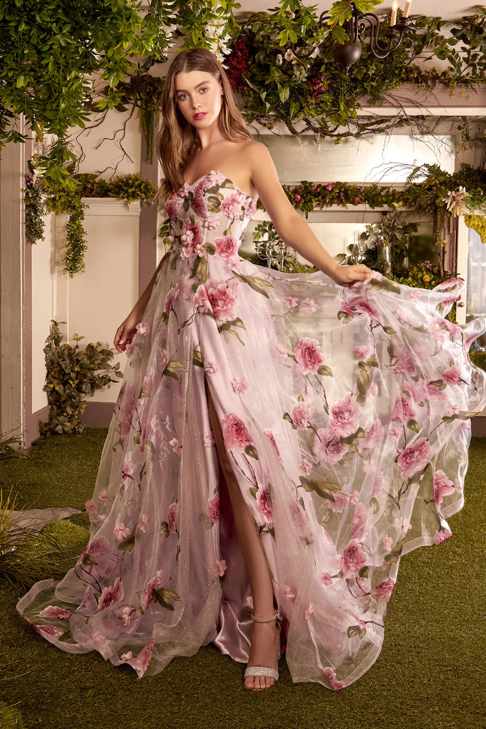 Andrea & Leo Couture A1035 Portrait of a Rose Printed Organza DressAndrea & Leo Couture A1035  Welcome to the fairytale world of magic and enchantment in this breathtaking A-line gown. This best selling gown is crafted from luxe Organza fabric, showing off an array of dimensional floral appliques and pink rose print. The strapless bodice features a sheer corset design, flaunting an ethereal blushing pink hue beneath a flourish of intricate roses and petals along the body. And