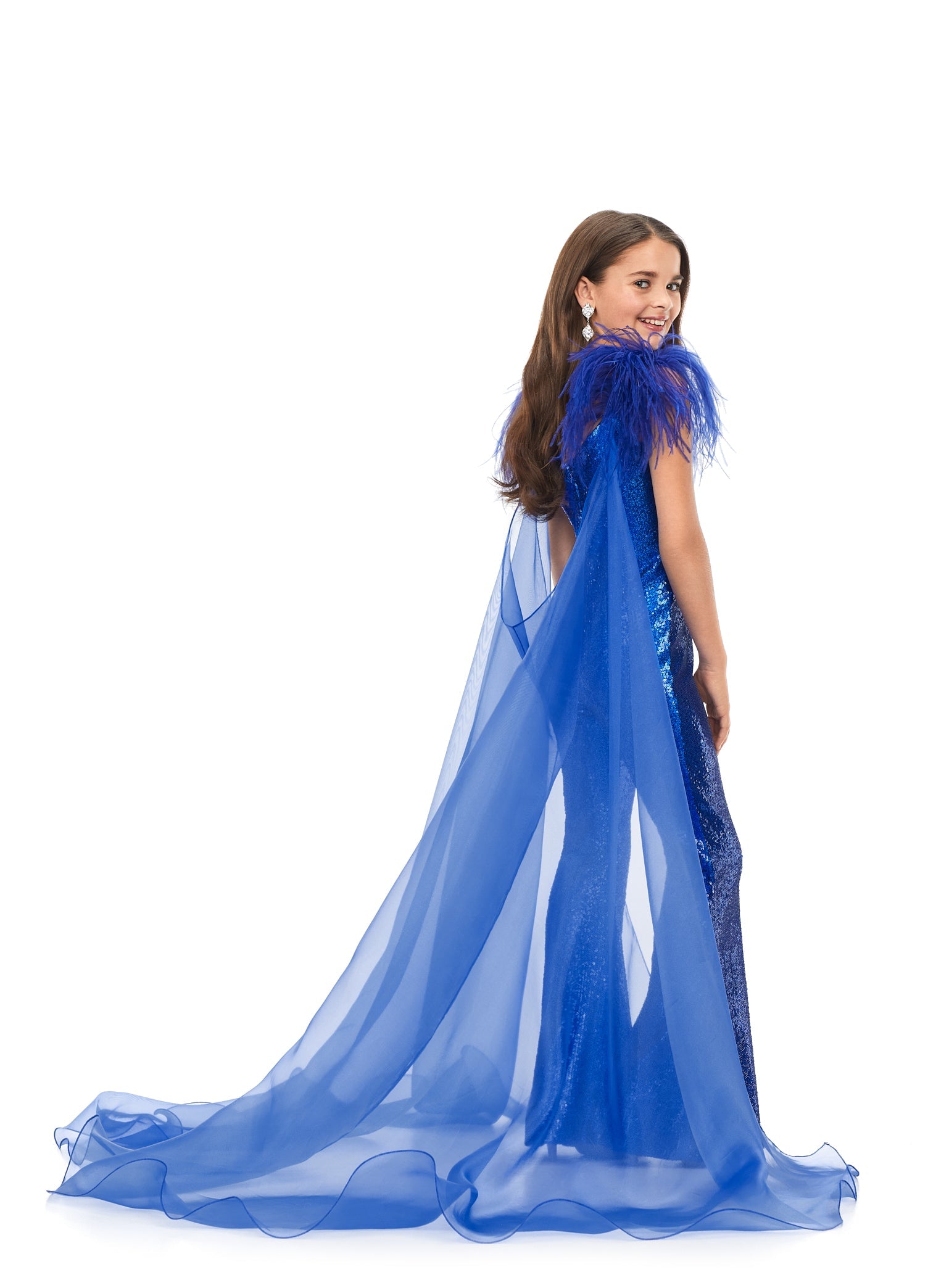 Ashley Lauren Kids 8174 Girls Sequin Jumpsuit with Organza Cape  Bring the drama in this kids sequin jumpsuit featuring a v-neckline. The look is complelted with an off the shoulder feather strap and organza cape.