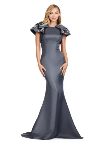 Elevate your evening look with the Ashley Lauren 11415 Charcoal Long Evening Mermaid Dress. This stunning gown features a double-faced satin fabric and intricate bow detail, perfect for a formal event or pageant. Embrace timeless elegance and make a statement with this expertly crafted dress. Make an entrance in this double faced satin gown complete with bow shoulders and beaded details. in this memorable dress styled with radiant beading on the layered shoulder straps.