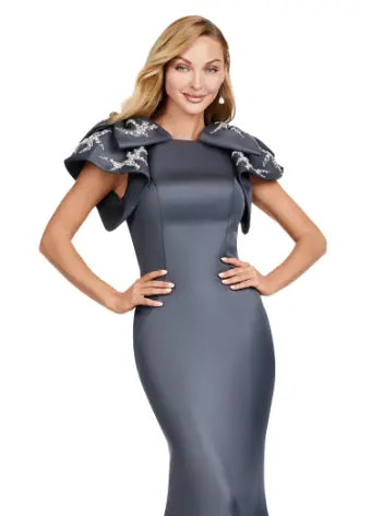 Elevate your evening look with the Ashley Lauren 11415 Long Evening Mermaid Dress. This stunning gown features a double-faced satin fabric and intricate bow detail, perfect for a formal event or pageant. Embrace timeless elegance and make a statement with this expertly crafted dress. Make an entrance in this double faced satin gown complete with bow shoulders and beaded details. in this memorable dress styled with radiant beading on the layered shoulder straps.
