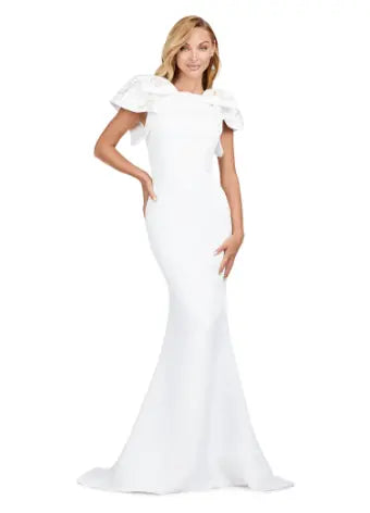 Elevate your evening look with the Ashley Lauren 11415 Ivory Mermaid Evening Dress. This stunning gown features a double-faced satin fabric and intricate bow detail, perfect for a formal event or pageant. Embrace timeless elegance and make a statement with this expertly crafted dress. Make an entrance in this double faced satin gown complete with bow shoulders and beaded details. in this memorable dress styled with radiant beading on the layered shoulder straps.