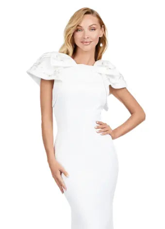 Elevate your evening look with the Ashley Lauren 11415 Long Ivory Evening Mermaid Dress. This stunning gown features a double-faced satin fabric and intricate bow detail, perfect for a formal event or pageant. Embrace timeless elegance and make a statement with this expertly crafted dress. Make an entrance in this double faced satin gown complete with bow shoulders and beaded details. in this memorable dress styled with radiant beading on the layered shoulder straps.