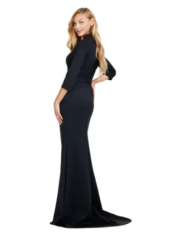 Introducing the Ashley Lauren 11418 Black Evening Dress, perfect for any formal occasion. This stunning mermaid style gown is made from high-quality scuba fabric, designed to hug your curves and create a sleek silhouette. The square neckline adds a touch of sophistication, making it a must-have for pageants and formal events. Dance the night away in this square neckline gown. The fitted gown is complete with three quarter length sleeves and a tonal belt. 