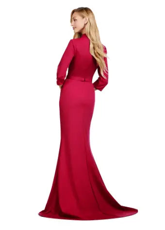 Introducing the Ashley Lauren 11418 Long Evening Dress, perfect for any formal occasion. This stunning burgundy mermaid style gown is made from high-quality scuba fabric, designed to hug your curves and create a sleek silhouette. The square neckline adds a touch of sophistication, making it a must-have for pageants and formal events. Dance the night away in this square neckline gown. The fitted gown is complete with three quarter length sleeves and a tonal belt. 