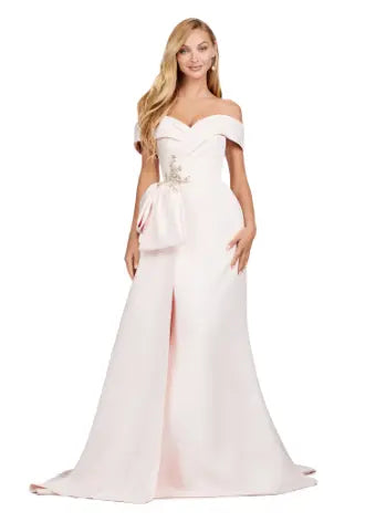 This Ashley Lauren 11425 Long Evening Dress is the perfect choice for any formal occasion. The off-shoulder design adds a touch of elegance, while the fitted satin fabric hugs your figure for a flattering silhouette. The overskirt adds a dramatic flare, making you feel like a pageant queen. Elevate your style with this versatile and stunning dress. An elegant off the shoulder neckline drapes the shoulders in elegant evening gown. The look is complete with beaded details and a side overskirt.