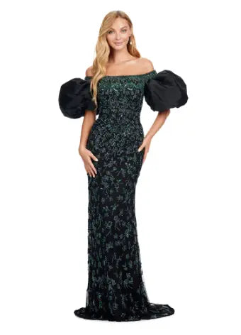 Make a statement with the Ashley Lauren 11432 black evening dress. Sparkling beads cover this off shoulder gown, featuring puff sleeves for a touch of drama. Perfect for formal events and pageants. Expertly crafted with quality materials for a luxurious feel. This fully beaded gown features taffeta puff sleeves that add the perfect amount of glam. The intricate bead pattern brings the entire look together.