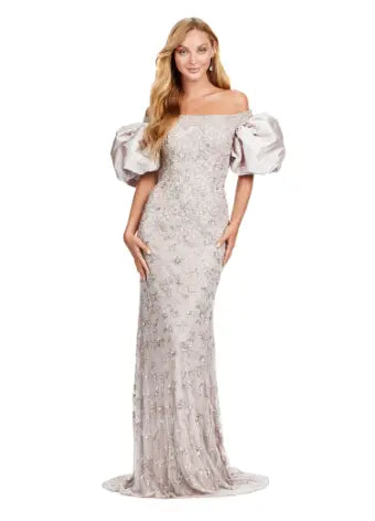 Make a statement with the Ashley Lauren 11432 long prom dress. Sparkling beads cover this off shoulder gown, featuring puff sleeves for a touch of drama. Perfect for formal events and pageants. Expertly crafted with quality materials for a luxurious feel. This fully beaded gown features taffeta puff sleeves that add the perfect amount of glam. The intricate bead pattern brings the entire look together.