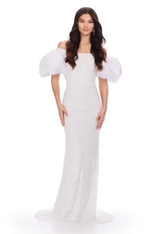 Make a statement with the Ashley Lauren 11432 long evening dress. Sparkling beads cover this off shoulder gown, featuring puff sleeves for a touch of drama. Perfect for formal events and pageants. Expertly crafted with quality materials for a luxurious feel. This fully beaded gown features taffeta puff sleeves that add the perfect amount of glam. The intricate bead pattern brings the entire look together.