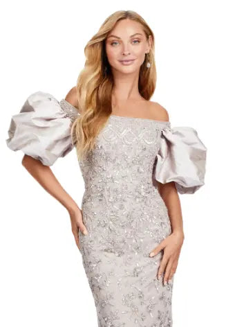 Make a statement with the Ashley Lauren 11432 long prom dress. Sparkling beads cover this off shoulder gown, featuring puff sleeves for a touch of drama. Perfect for formal events and pageants. Expertly crafted with quality materials for a luxurious feel. This fully beaded gown features taffeta puff sleeves that add the perfect amount of glam. The intricate bead pattern brings the entire look together.