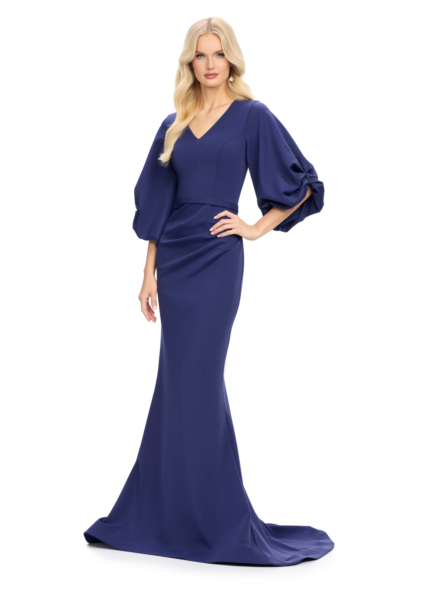 Elevate your evening look with the stunning Ashley Lauren 11740 Long Gathered Sleeves Evening Gown. The scuba fabric provides a sleek and comfortable fit, while the belted waistline accentuates your figure. The gathered sleeves add an elegant touch to this chic gown, making it perfect for any special occasion.