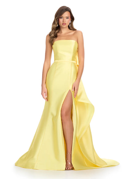 Ashley Lauren 11866 Mikado Strapless Gown With Bow.&nbsp; We love a bow! This strapless mikado gown features a belt and left leg slit. The look is complete with a back bow that cascades down the back and onto the sweep train.

Strapless
Mikado
Left Leg Slit
Ruffle Detail
Colors:&nbsp; Red, Yellow, Black/White, Pink, White
