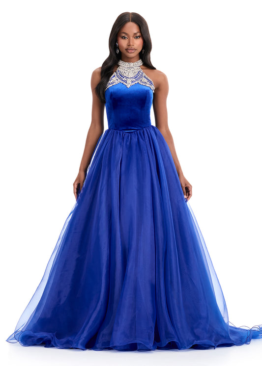 Make a grand entrance in the ASHLEYlauren Style 12050 velvet and organza ball gown. Featuring a beaded halter neckline on a velvet bodice, this gown flows into a full organza skirt with a dramatic train, perfect for proms, pageants, and formal occasions.

Available in Royal, Black/Ivory
Velvet Halter Neck Ball Gown with Organza Skirt and Train
Ideal for Proms, Pageants, Formal Events

Structured velvet bodice with delicate beadwork and a voluminous organza skirt designed for elegance and impact.