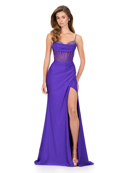 Step into sophistication with this sleek and elegant jersey gown, ASHLEYlauren Style 12173. Featuring a beaded bustier-style bodice with delicate spaghetti straps, this fitted dress highlights your figure with a ruched waist and flattering draped skirt. The corset detailing adds structure and sparkle, while the sweeping train ensures a glamorous finish. Perfect for prom, pageant, or any formal event, this gown brings modern allure and timeless elegance together.

Available in Emerald, Purple, Red, Black, Fu