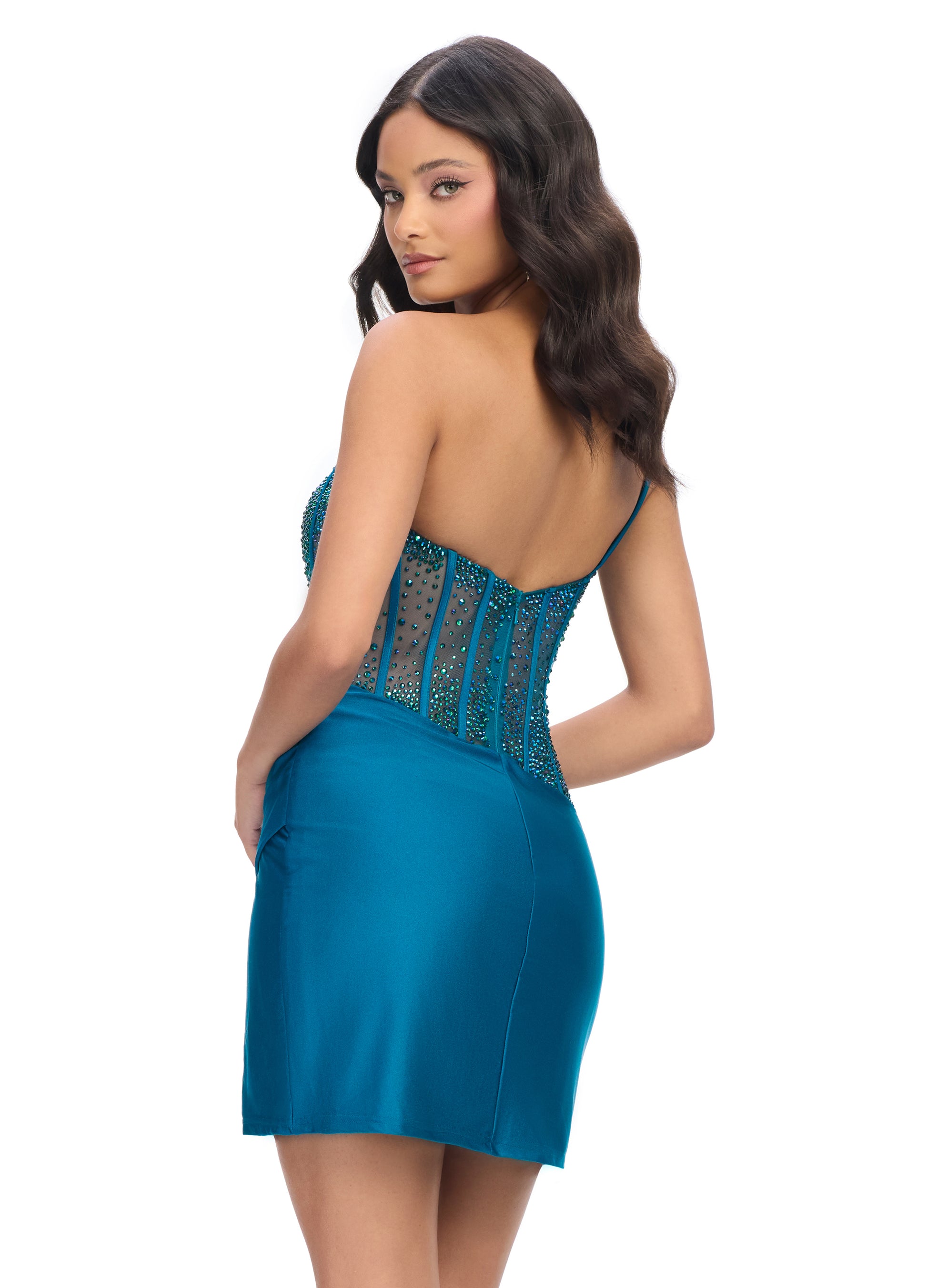 Ashley Lauren 4691&nbsp;The perfect cocktail dress does exist! Featuring a fully beaded corset bustier and left leg slit, this dress will have you looking extra fabulous!

One Shoulder
Corset Bustier
Press on Stones
Wrap Skirt
Colors:&nbsp;Peacock, Black, Red, Magenta, Purple, Royal
